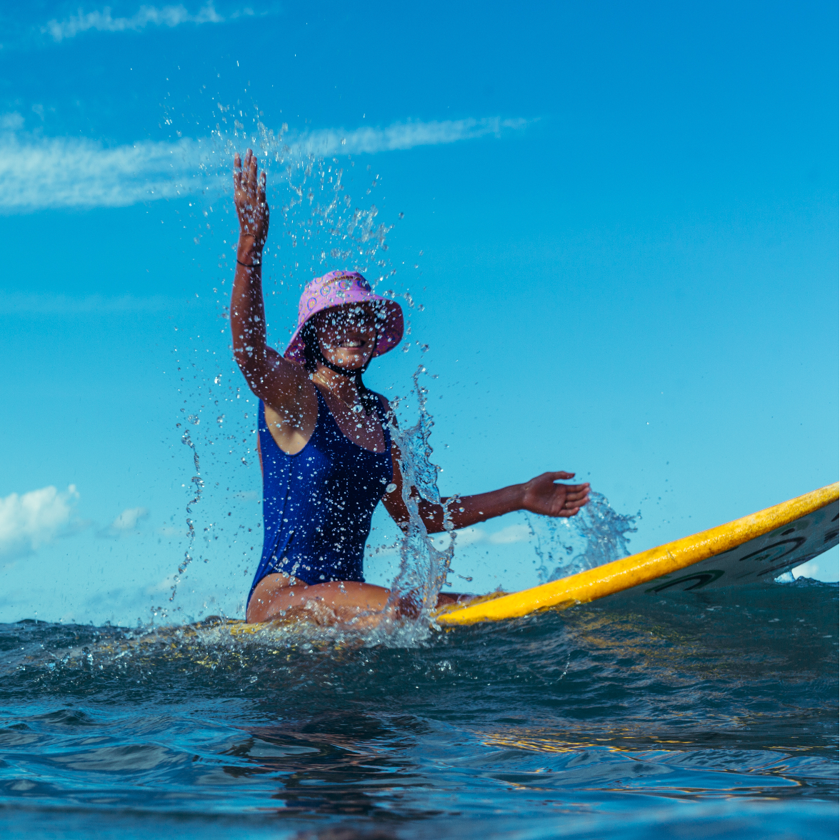 Leihani Zoric wearing plow surf co surf hat designed by Leihani Zoric Indigenous Australian artist and surfer to support her surfing goals